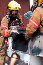 Firefighters Remove Burned Dryer